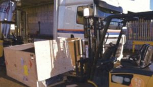 Fallen Crate Beside The Forklift Truck
